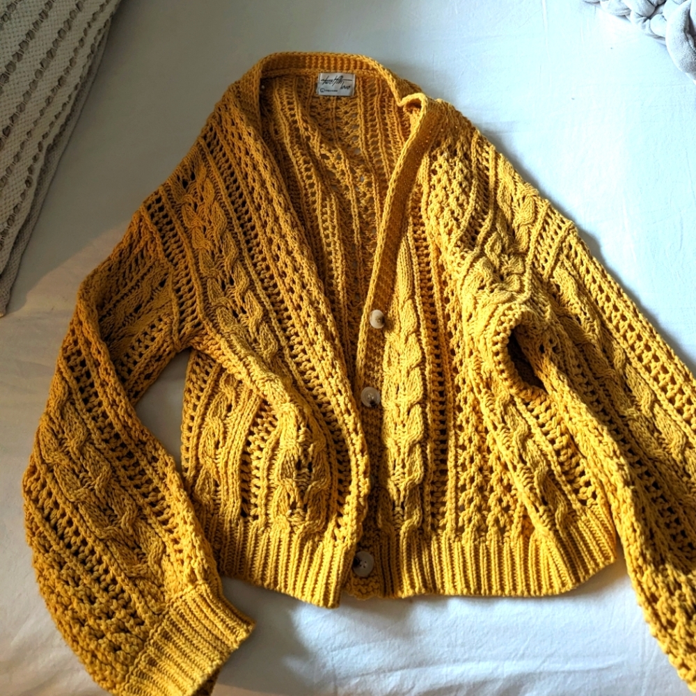 Yellow sweater, size L.
